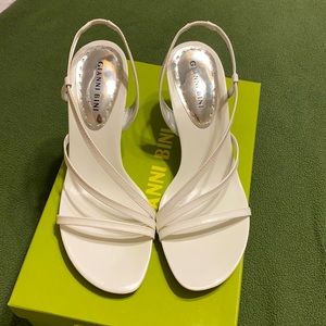 White sandals with heels. New in box.